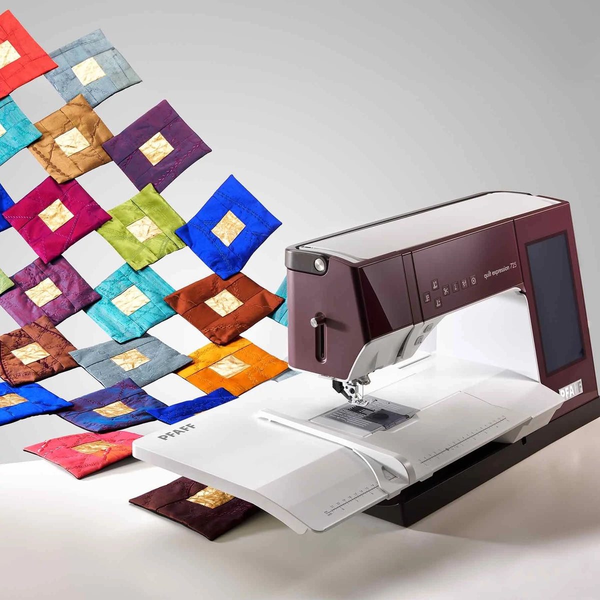 PFAFF quilt expression 725 surrounded by creative quilt blocks